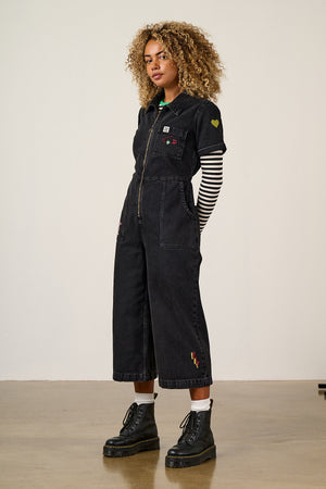 Ragan - Denim Jumpsuit in Washed Black with Punk Energy Patches