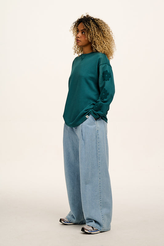 Kai - Midweight Cotton Crew Neck Sweatshirt in Teal Tucker with Flower Motif