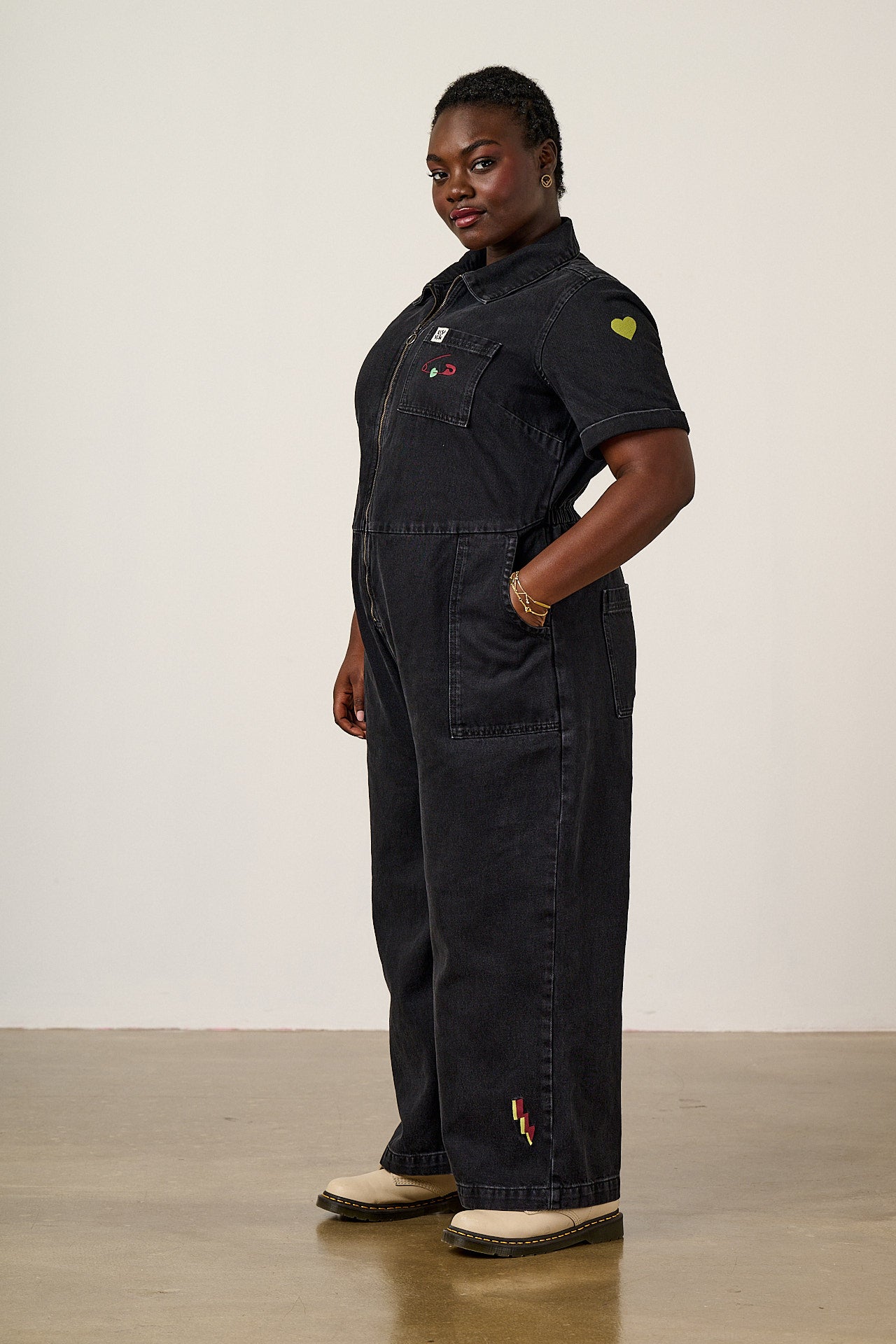Ragan - Denim Jumpsuit in Washed Black with Punk Energy Patches