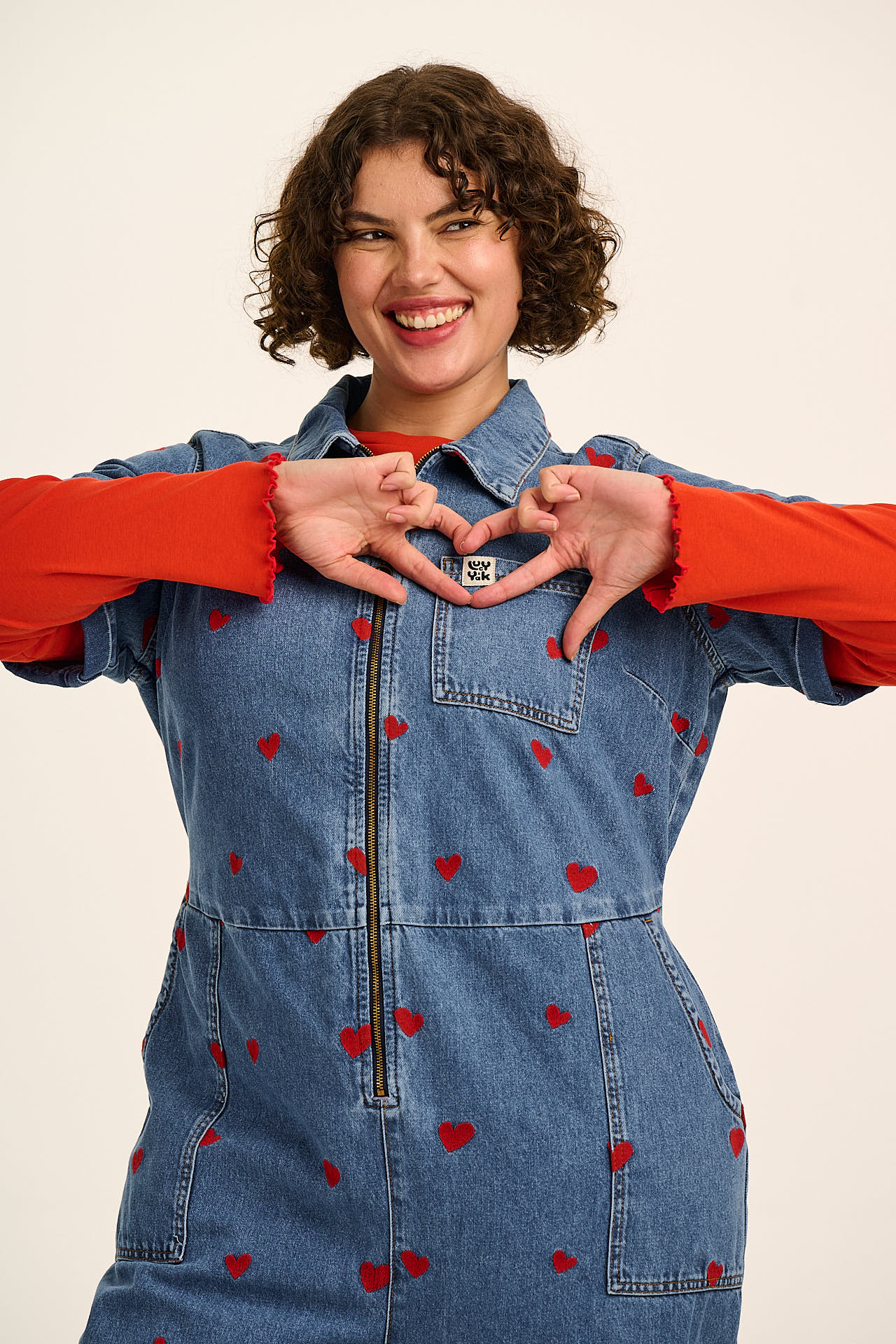 Ragan - Denim Jumpsuit in Mid Wash with Cupid Hearts