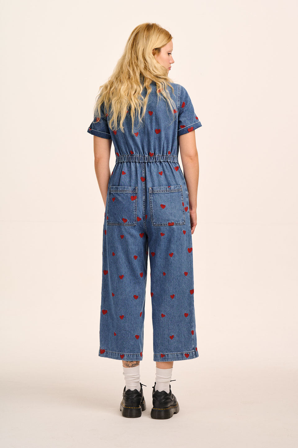 Ragan - Denim Jumpsuit in Mid Wash with Cupid Hearts